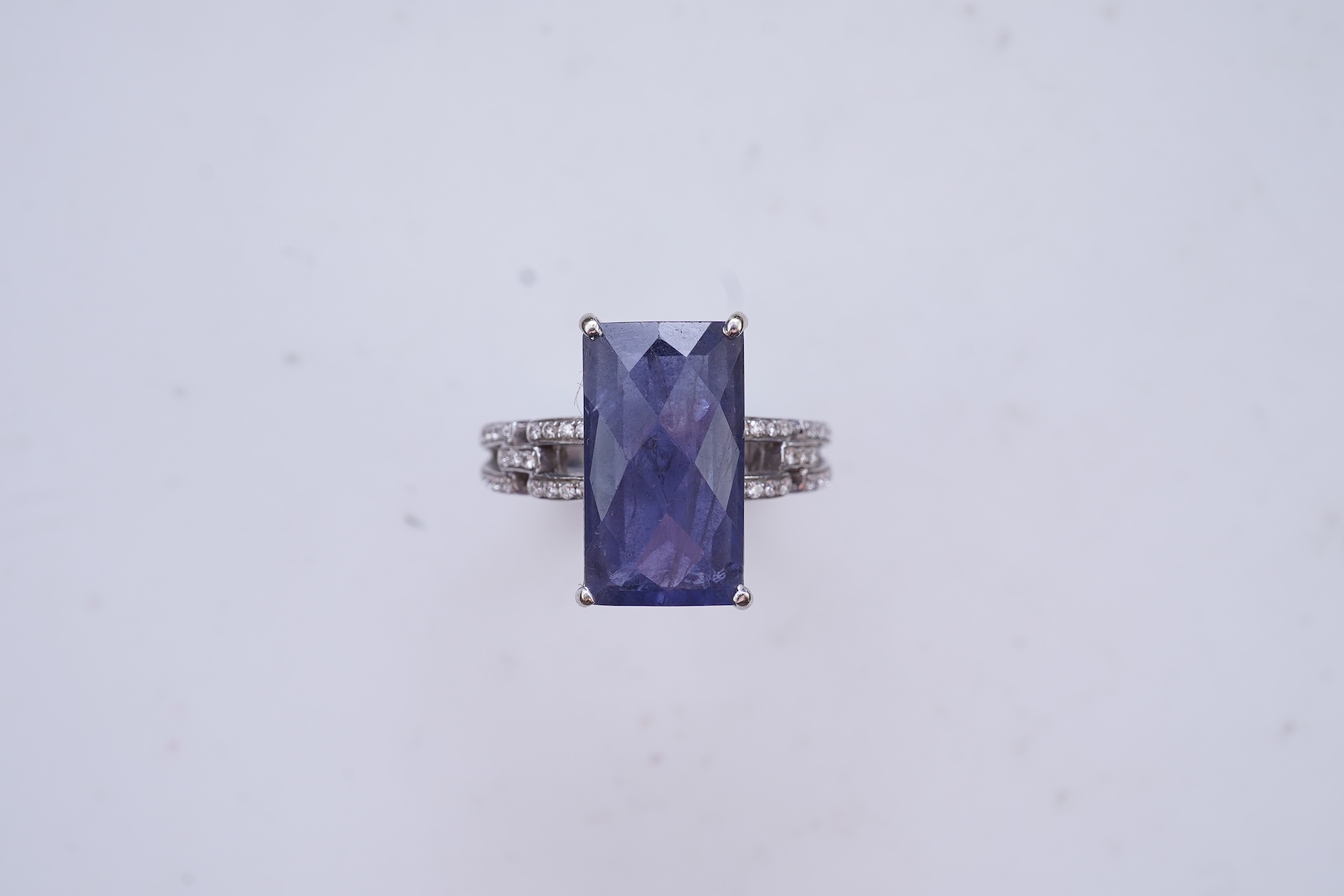 An iolite and diamond ring